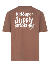 KIDSUPER - Relaxed fit T-shirt featuring a ribbed crew neck, short sleeves and slightly dropped shoulders. Detailed with a stylized lettering print across the upper front and a straight hem. - Brown - LIDIASHOPPING® - Official Website
