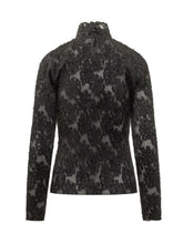 GANNI - Coupe top featuring a fitted silhouette, high neckline and long sleeves. Detailed with an openwork floral pattern and a raised textured surface. - Black - LIDIASHOPPING® - Official Website